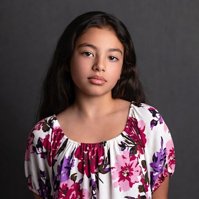 Young Latina girl in floral dress