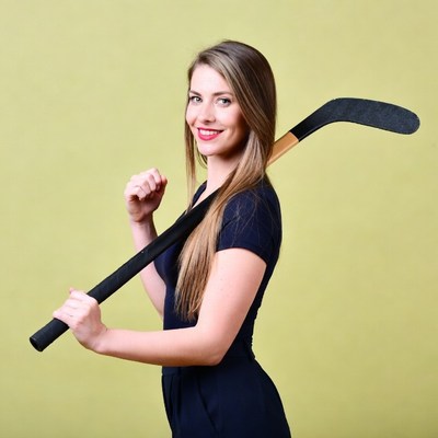 Woman holding hockey stick