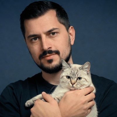 Man holding white cat