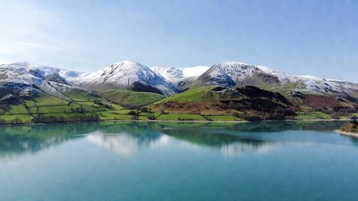 Snowy Mountains Reflecting in Lake