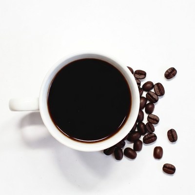 Black coffee cup with beans