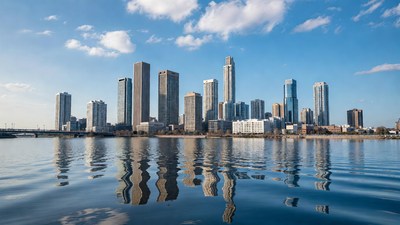 Modern skyline reflecting in river