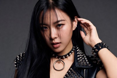Asian woman in spiked leather outfit