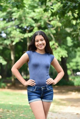 Smiling Asian girl in park