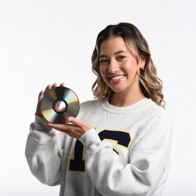 Smiling woman holding CD disc