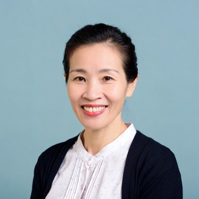 Asian woman smiling in blouse