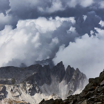 Dramatic Mountain Peaks Under Storm Clouds