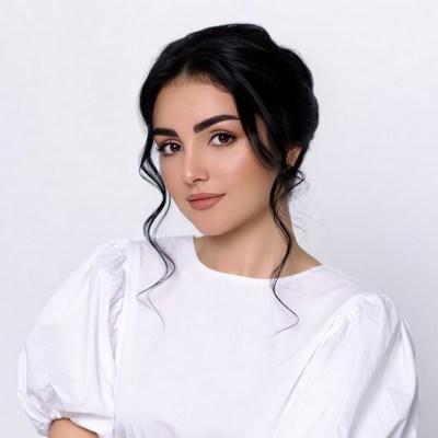 Beautiful Middle Eastern woman in white blouse