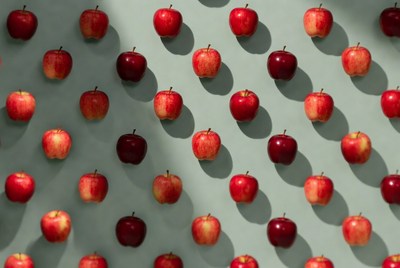 Red Apples Pattern on Green Background
