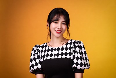 Asian woman in black white dress