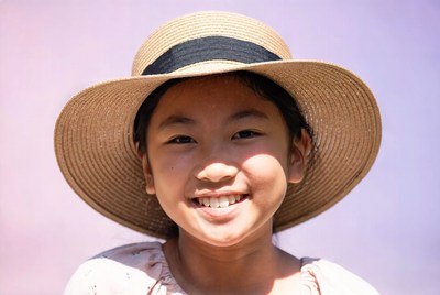 Asian girl smiling in straw hat