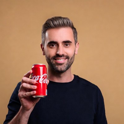 Man holding Coca-Cola can