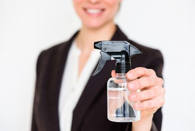 Woman holding spray bottle