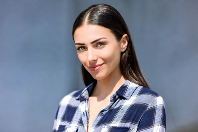 Smiling woman in plaid shirt