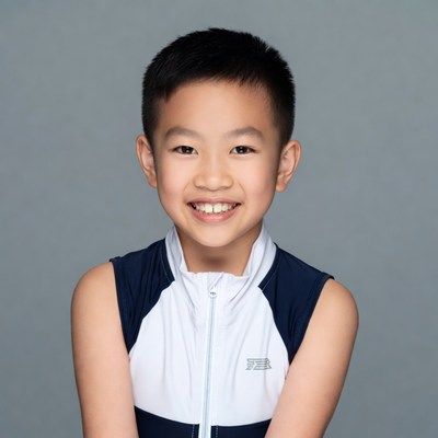 Asian boy smiling in sportswear
