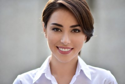 Smiling woman in white shirt