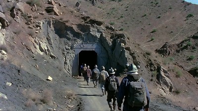 Miners entering mountain tunnel