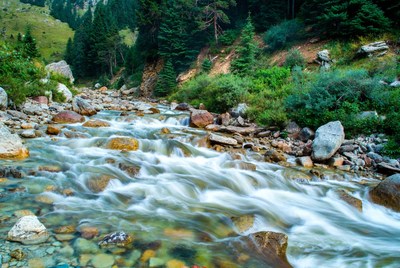 Mountain River Flowing Through Rocks