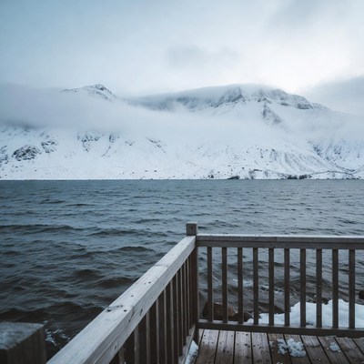 Snowy Mountains Over Frozen Lake Dock