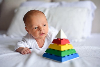 Baby playing with stacking toy