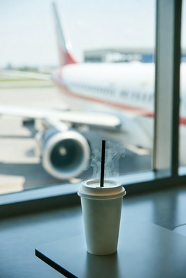 Coffee cup with airplane view