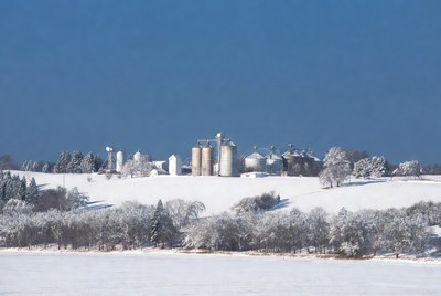 Grain Silos in Snowy Landscape