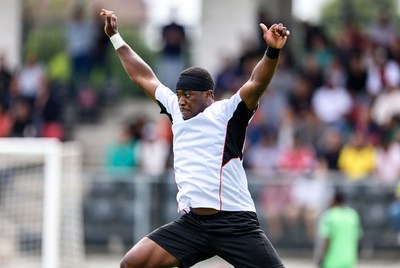 African-American soccer player celebrating goal