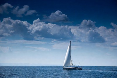 White sailboat sailing on ocean