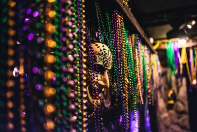 White Mask Amid Mardi Gras Beads