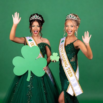Two girls in green St. Patrick's gowns with shamrocks