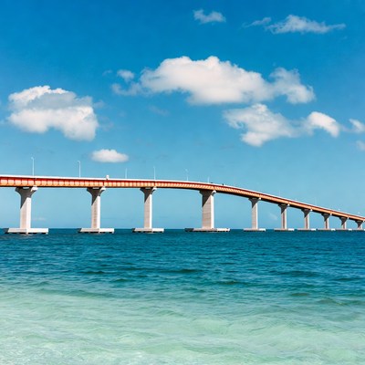 Orange bridge over turquoise ocean