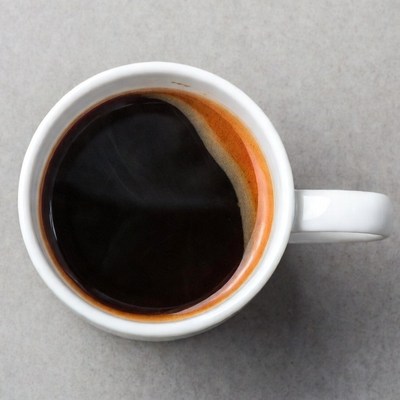 Cup of black coffee overhead view