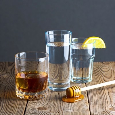 Whiskey, Water Glasses, Honey Dripping