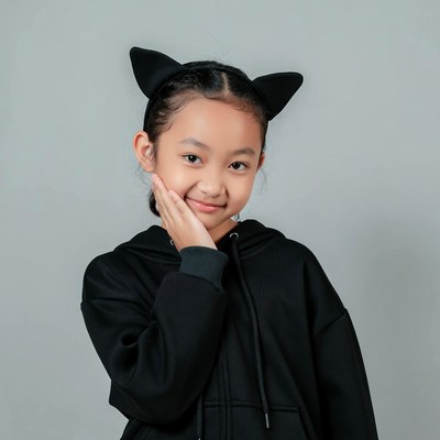 Asian girl with cat ears headband