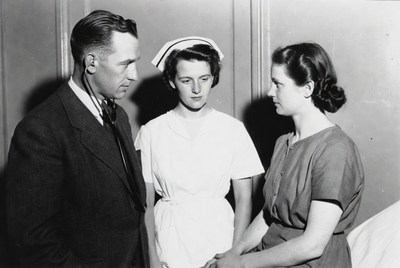 Doctor and Two Nurses Talking