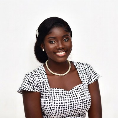 Smiling African woman in polka dot dress