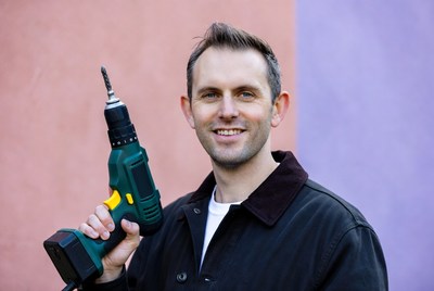 Man holding green power drill
