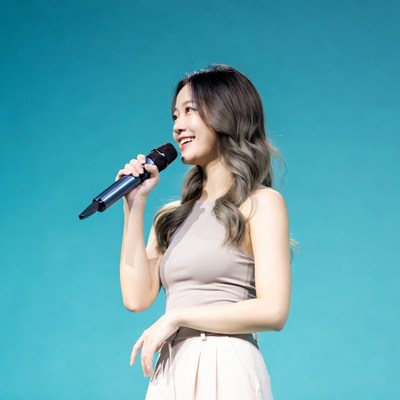 Asian woman singing with microphone