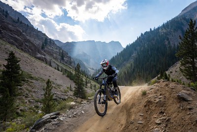 Mountain biker riding downhill trail