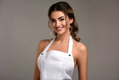 Smiling woman in white apron