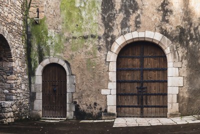 Old Wooden Doors on Stone Wall