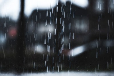 Heavy rain falling in blurred background