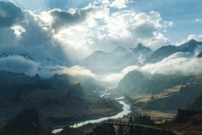 Wooden Bridge over River in Snowy Mountains