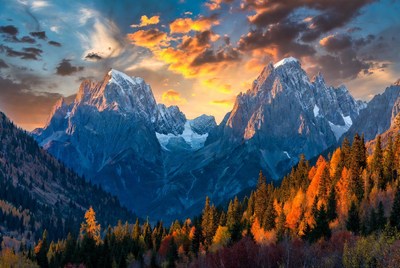 Snowy Mountains at Sunset with Autumn Forest