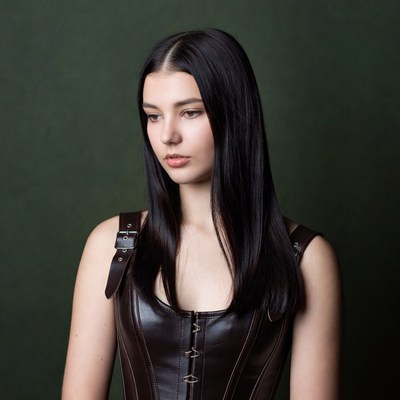 Woman in black leather corset