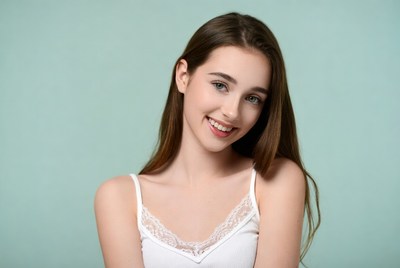 Smiling girl in lace camisole