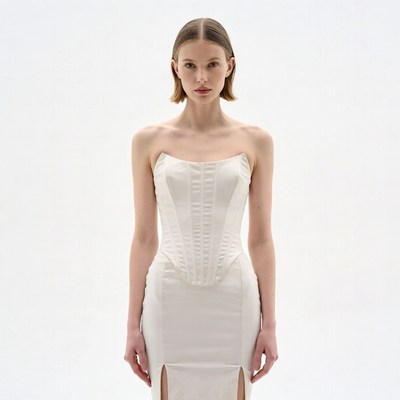 Woman in white strapless corset dress