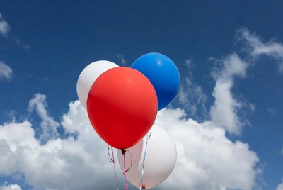 Red White Blue Balloons Against Sky