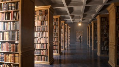 Silhouette in grand library hallway