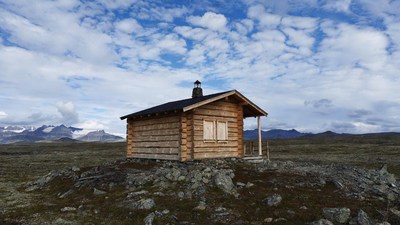Log Cabin on Rocky Hill with Mountains